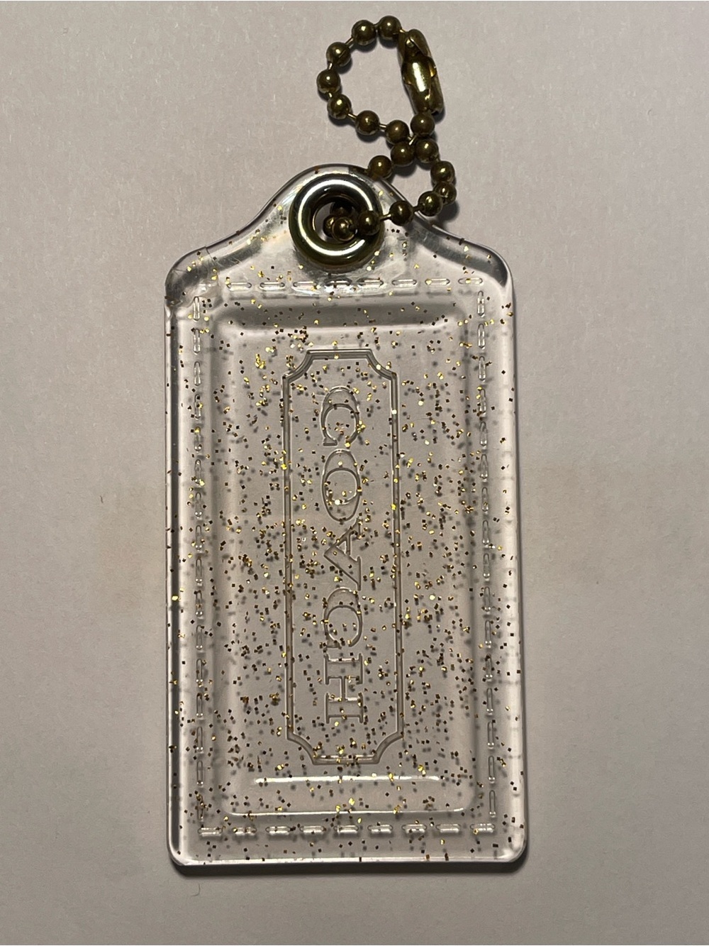 Coach Poppy Clear Glitter Tag Charm with Gold-Tone Ball Chain - Picture 2 of 4